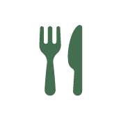 A green icon of a fork and knife placed side by side on a white circular background.